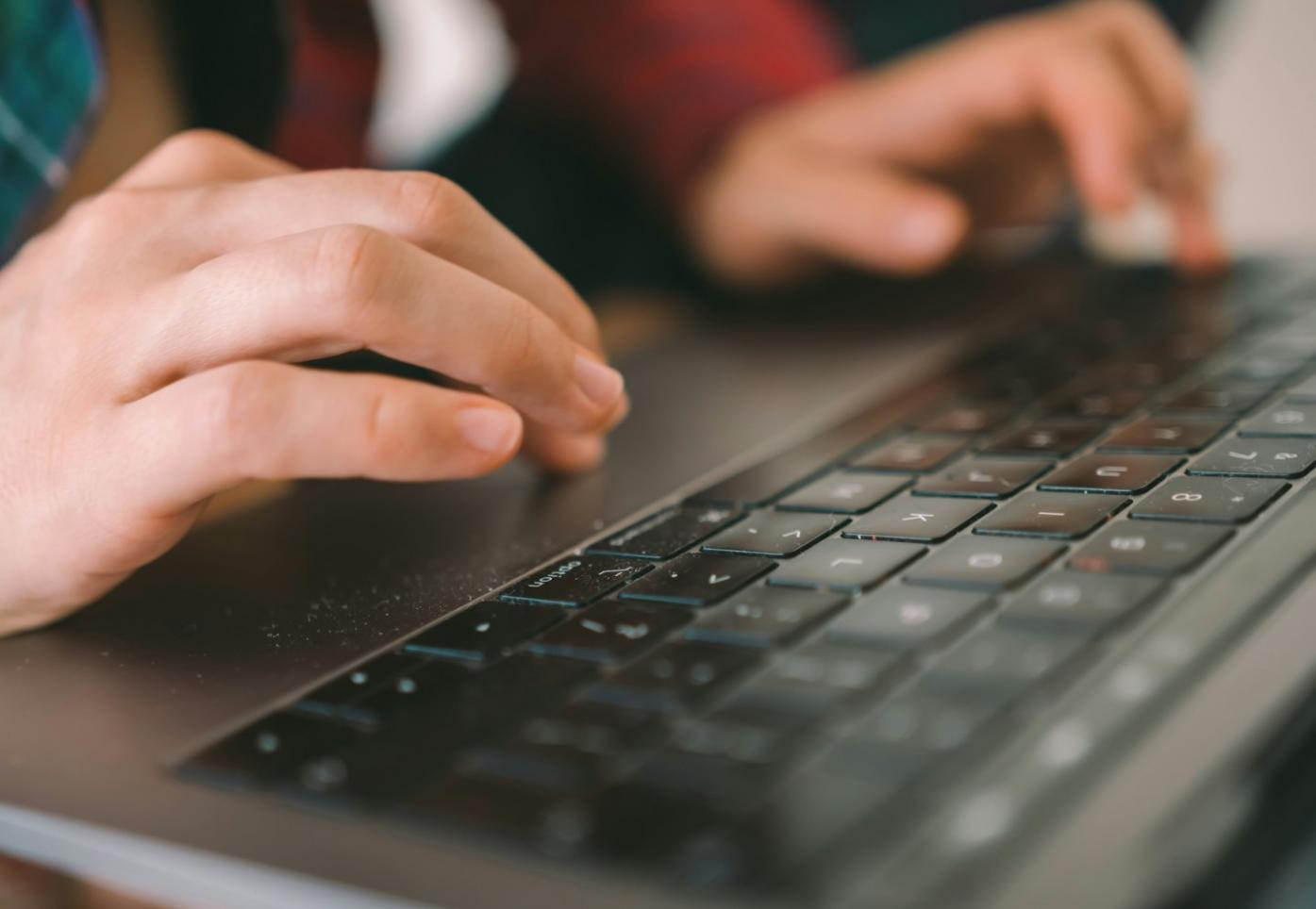 Modern office workspace with financial analysis tools and market research materials